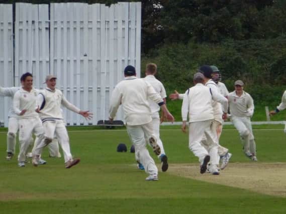 Hastings Priory celebrate after taking the last wicket in their final day victory over Crowhurst Park. Picture by Simon Newstead (SUS-150609-135848002)