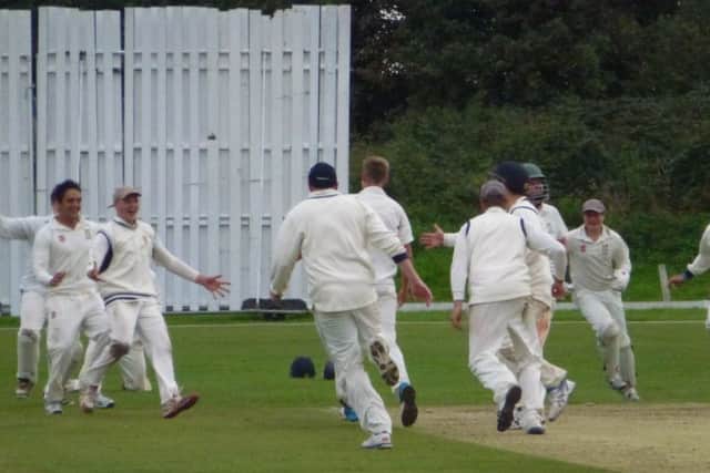 Hastings Priory celebrate after taking the last wicket in their final day victory over Crowhurst Park. Picture by Simon Newstead (SUS-150609-135848002)