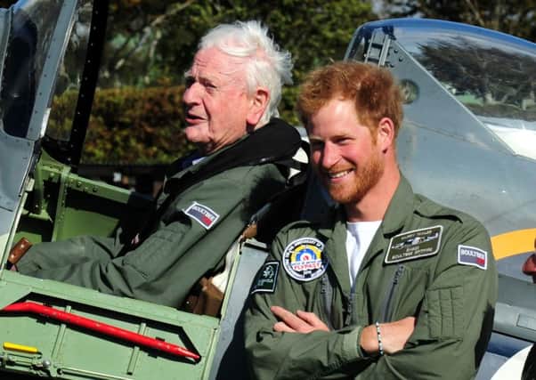 Prince Harry and Battle of Britain veteran, Tom Neil, 95, who took to the skies in a Spitfire PICTURE BY KATE SHEMILT ks1500450-27