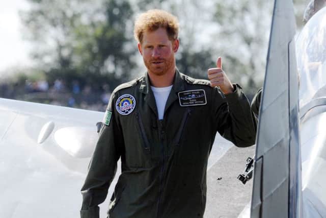 A thumbs up from Prince Harry for veteran of the Battle of Britain Tom Neil, 95, as he takes to the sky PICTURE BY KATE SHEMILT ks1500450-2