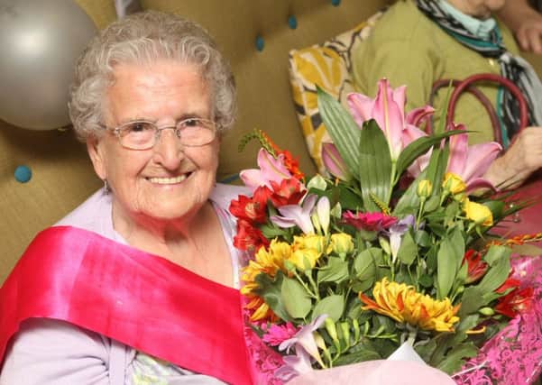 Marjorie Smithson celebrates her 100th birthday. Photo by Derek Martin DM15115283a