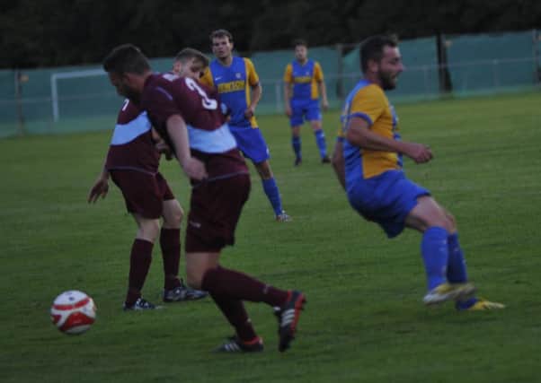 Action from the game between Little Common and Bexhill United on Wednesday, last week. Picture by Simon Newstead