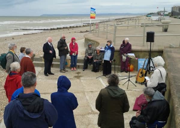 Members of the Bexhill and Hastings United Nations Association gathered on Bexhill beach to mark the International Day of Peace.