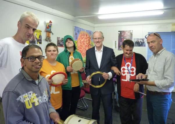MP Nick Gibb taking part in a music group at the Aldingbourne Country Centre