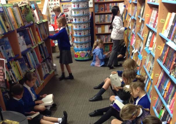 Pupils at St Mary's in Horsham with their new books SUS-150928-125401001