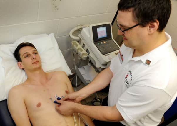 Cardiac Scientist Peter Lewis scans for heart problems at Billingshurst Leisure Centre as part of a large scanning process in connection with Weald School. Pic Steve Robards SR1521979 SUS-150915-175609001