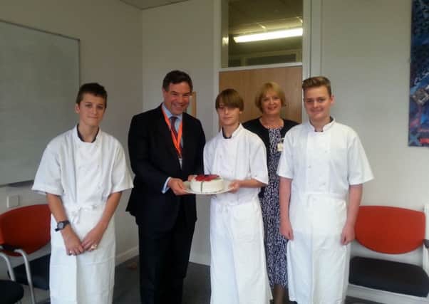 The Forest School catering students present MP Jeremy Quin with a birthday cake during his visit SUS-150510-125439001