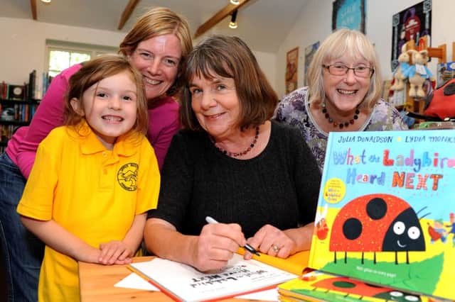 Julia Donaldson (author of The Gruffalo) signed copies of her new book at Steyning Bookshop. Pictured here with Katie Watts and her daughter Imogen (from Steyning) and far right bookshop owner Sara Bowers. Pic steve robards SR1522264 SUS-150918-171431001