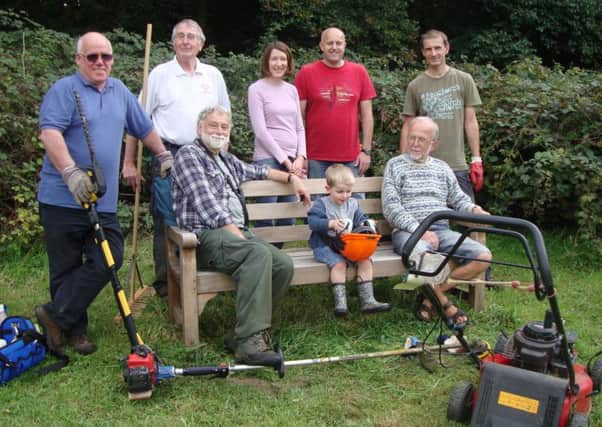 Members of the Group taking a break during preparations for Saturday's Annual Fun Scarecrow Event in Earles Meadow SUS-150921-160230001