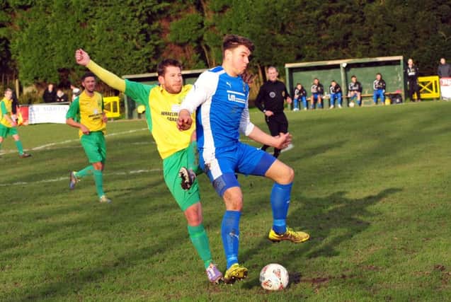 Jethro Warren (yellow and green kit) has resigned as Westfield Football Club manager