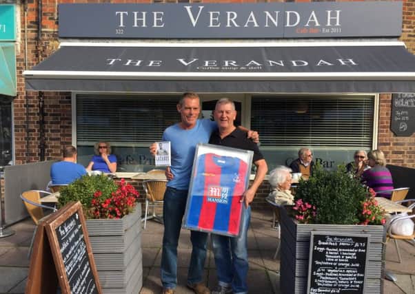 Rod Wood, left, and Trevor Jones, owner of The Verandah, with the Crystal Palace shirt