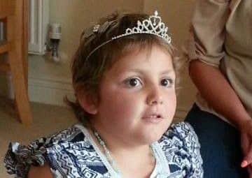Brave Amelia-Jayne, six, wearing her special tiara before it was taken