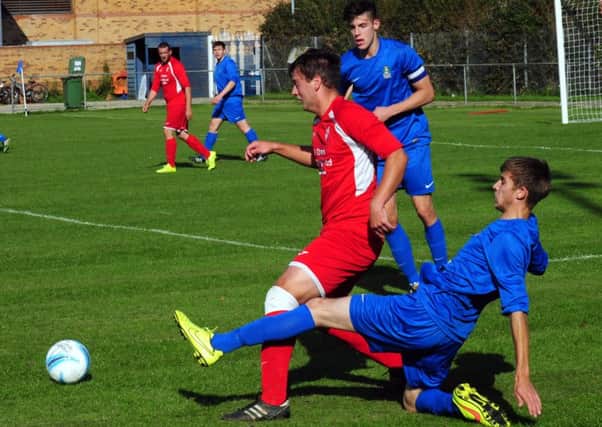 Selsey's Jake Jackson gets stuck in against Seaford / Picture by Kate Shemilt