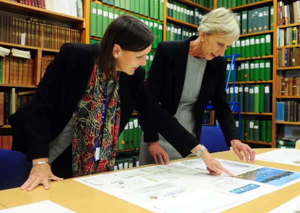 Wendy Walker, County Archivist with Louise Goldsmith, Leader of West Sussex County Council, looking at some of the messages left. ks1500488-1 SUS-150928-164211008