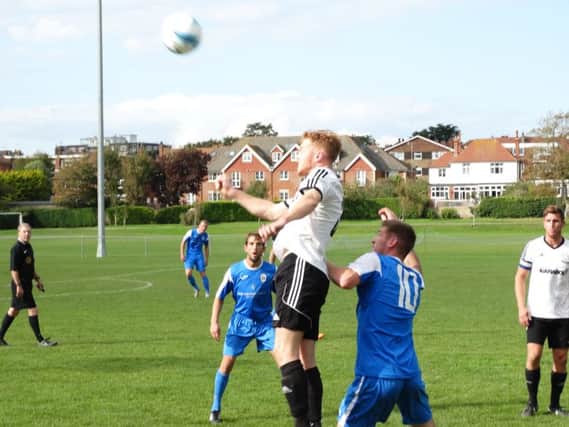 Nathan Tudor rises highest during Bexhill United's 5-1 defeat at home to Haywards Heath Town. Picture courtesy Mark Killy