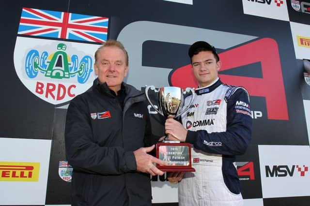 Will Palmer recieves Formula 4 championship trophy from Jonathan Palmer