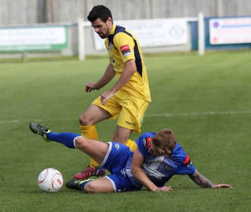 Sam Crabb in the thick of the action for Hastings United against Herne Bay on Saturday. Picture courtesy Scott White