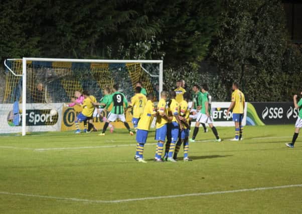 Phil Johnson reacts first to nod home leveller at Staines Town