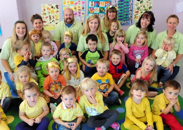 Dizzy Ducklings Pre-School dressed in yellow and gold for Childhood Caner Awareness Month ks1500484-1