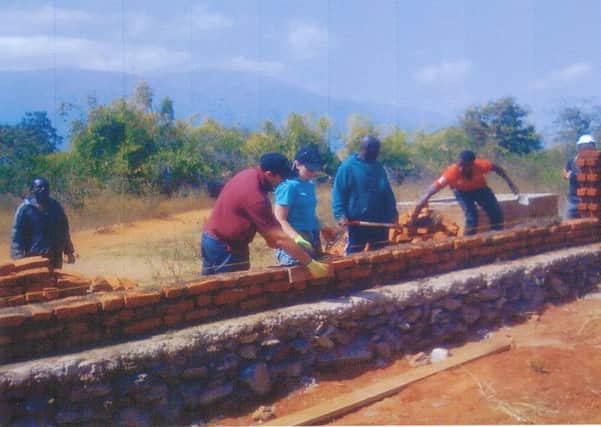 Building the wall for the new classrooms at the school