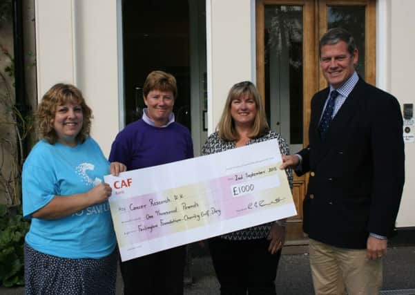 Farlington School presents cheque to Cancer Research UK SUS-150930-122306001