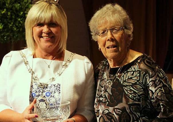Auriel Wakeling receives the Parishioners Award from Rustington Parish Council chairman Alison Cooper
