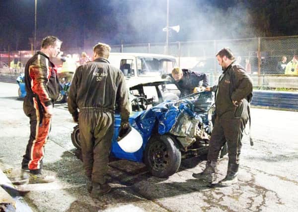 Bears, Ash and Justin Riley discuss the finer points of racing with dutchman Robert Emaus at the end of the night (Dan Moth)