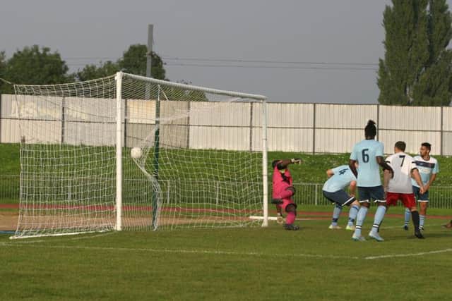 Ashley Dugdale goal for YM hits the Croydon FC net. Photo by Clive Turner