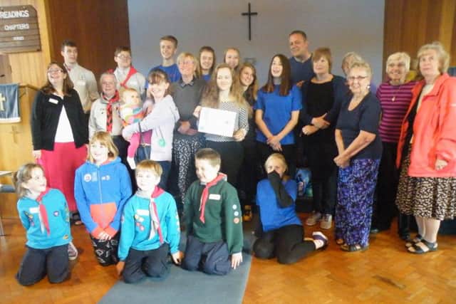 Children and leaders receiving the Child Friendly Church Re-Award