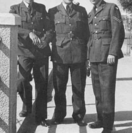 Cyril Robert, leaning against the railings, with RAF colleagues