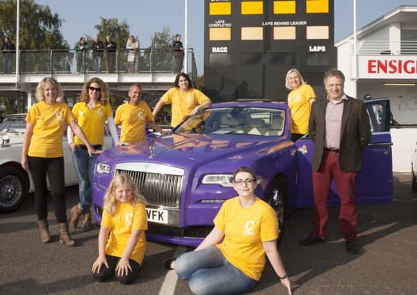 Chestnut Tree House deputy chief executive Jeremy Cox and his team, Terrina Barnes, Sarah Arnold, Alison and Miah Taylor, Steve Colbourne, Emily Skiggs and Sarah Miles. with the purple Rolls Royce