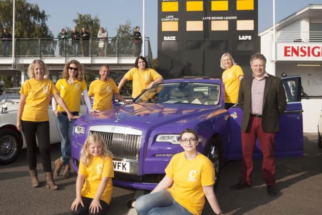 Chestnut Tree House deputy chief executive Jeremy Cox and his team, Terrina Barnes, Sarah Arnold, Alison and Miah Taylor, Steve Colbourne, Emily Skiggs and Sarah Miles. with the purple Rolls Royce
