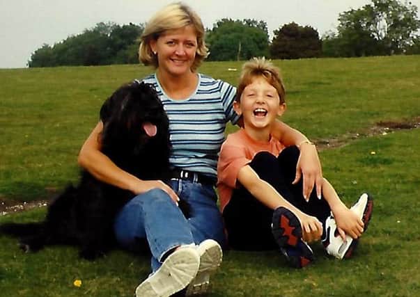 Joshua Bennett with his mother Donna and beloved dog, Digger