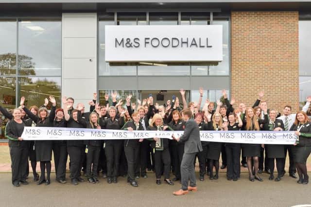 The new Marks and Spencer Foodhall is opened in Bognor Regis as manager Steve Lake cuts the ribbon