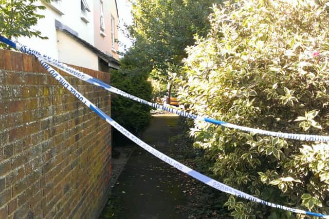 Police tape remains after last night's evacuation of Woodfield Close