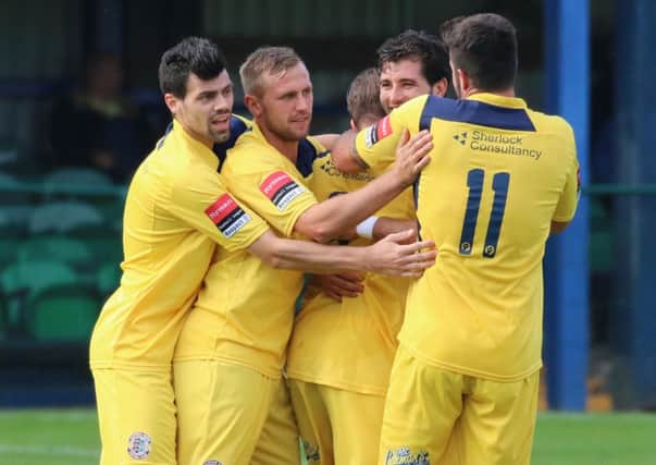 Hastings United celebrate scoring during their FA Trophy win away to Wroxham last weekend. Picture courtesy Joe Knight