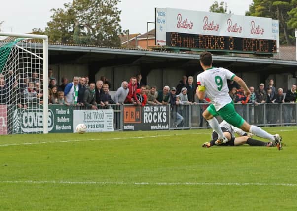 Jason Prior slots in the fourth goal against Oxford City, which secured the Rocks' place in the fourth qualifying round / Picture by Tim Hale