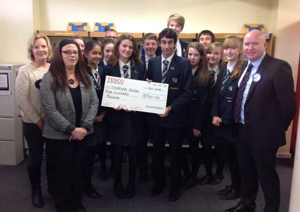 Tanbridge House Students with their sponsorship donation from Tesco in Broadbridge Heath SUS-150311-101526001