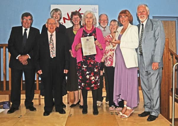 Snak Shak trustees including the five founder members receiving the prestigious award. PHOTO BY DAVE NICHOLLS SUS-151013-090859001