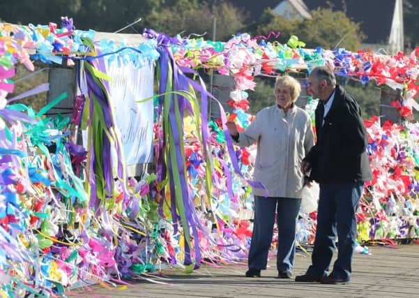 SHOREHAM TOLL BRIDGE 9-10-15 - NOW BRIDGE OF RIBBONS, PUT IN PLACE OVERNIGHT BY FAMILY AND FRIENDS OF MATT JONES - LOVELY SIGHT - MEMBERS OF THE PUBLIC ADMIRE THE MEMORIAL SIGHT OF RIBBONS SUS-151013-092941001