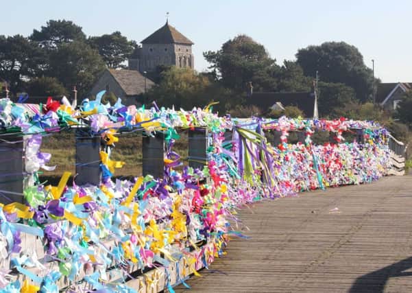 SHOREHAM TOLL BRIDGE 9-10-15 - NOW BRIDGE OF RIBBONS, PUT IN PLACE OVERNIGHT BY FAMILY AND FRIENDS OF MATT JONES - LOVELY SIGHT - MEMBERS OF THE PUBLIC ADMIRE THE MEMORIAL SIGHT OF RIBBONS SUS-151013-093014001