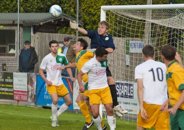 City keeper Jack Fagan and his defence try to keep Horsham at bay / Picture by Tommy McMillan