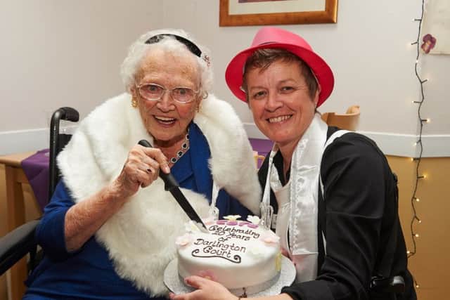 Home manager Fiona Wiederkehr and resident Mary Mount cut the birthday cake. Picture: Simon Jacobs