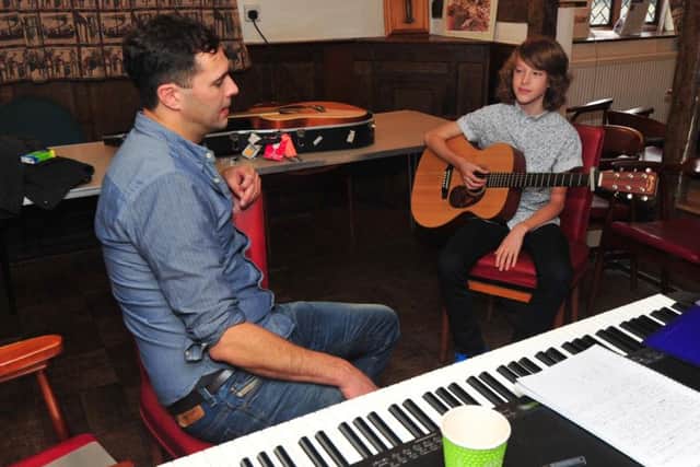24/10/14- Keane's Tim Rice-Oxley gives advice and guidance to Will Pollard- part of Battle Festival.  Will Pollard is the grandson of popular local man Derek Norcross. SUS-141024-131135001