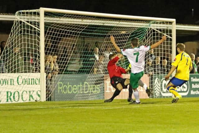 Alfie Rutherford puts the Rocks 1-0 up against Farnborough / Picture by Tim Hale