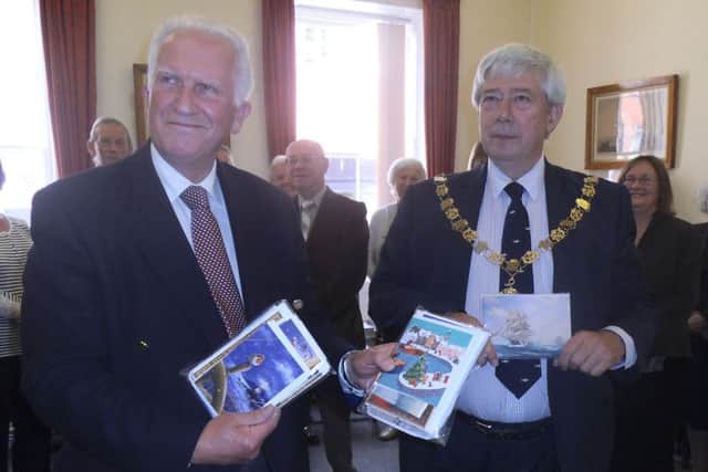 Malcolm Williams, chief executive of the society, and Chichester mayor Peter Budge with some of the cards