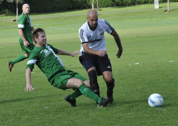 Bexhill United manager Marc Munday in the thick of the action during last month's draw at home to Mile Oak in the league (SUS-150919-193831002)
