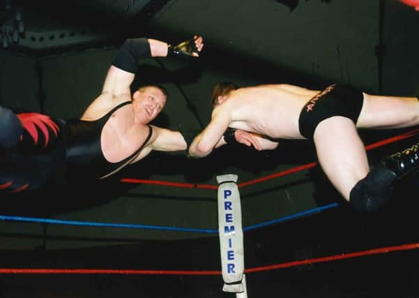 Philip  Barham (left) and Doug Williams clash in a Premier Promotions ring at Worthing