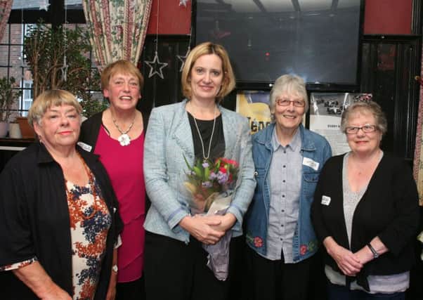 Rye MP Amber Rudd with members of the Rye Community Charity Shop's management committee