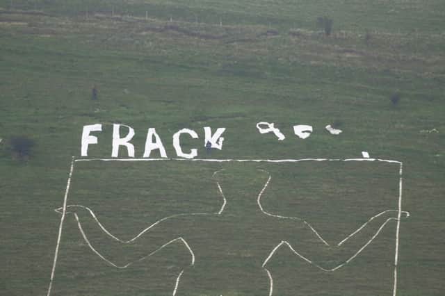 LONG MAN OF WILMINGTON 'FRACK OFF" TEAM THAT PLACED IT UP THERE - ANGRY FARMERS REMOVED IT - CONTACT GROUP ON 07754750051 - BECKY SUS-151016-114151001